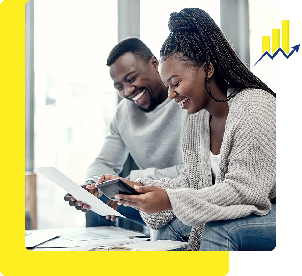 A man and woman looking at an ipad.